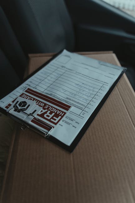 A close-up image of a floral bouquet arrangement destined for same day flower delivery to Kidbrooke Station, displayed on top of a cardboard box inside a vehicle. The bouquet features a vibrant mix of